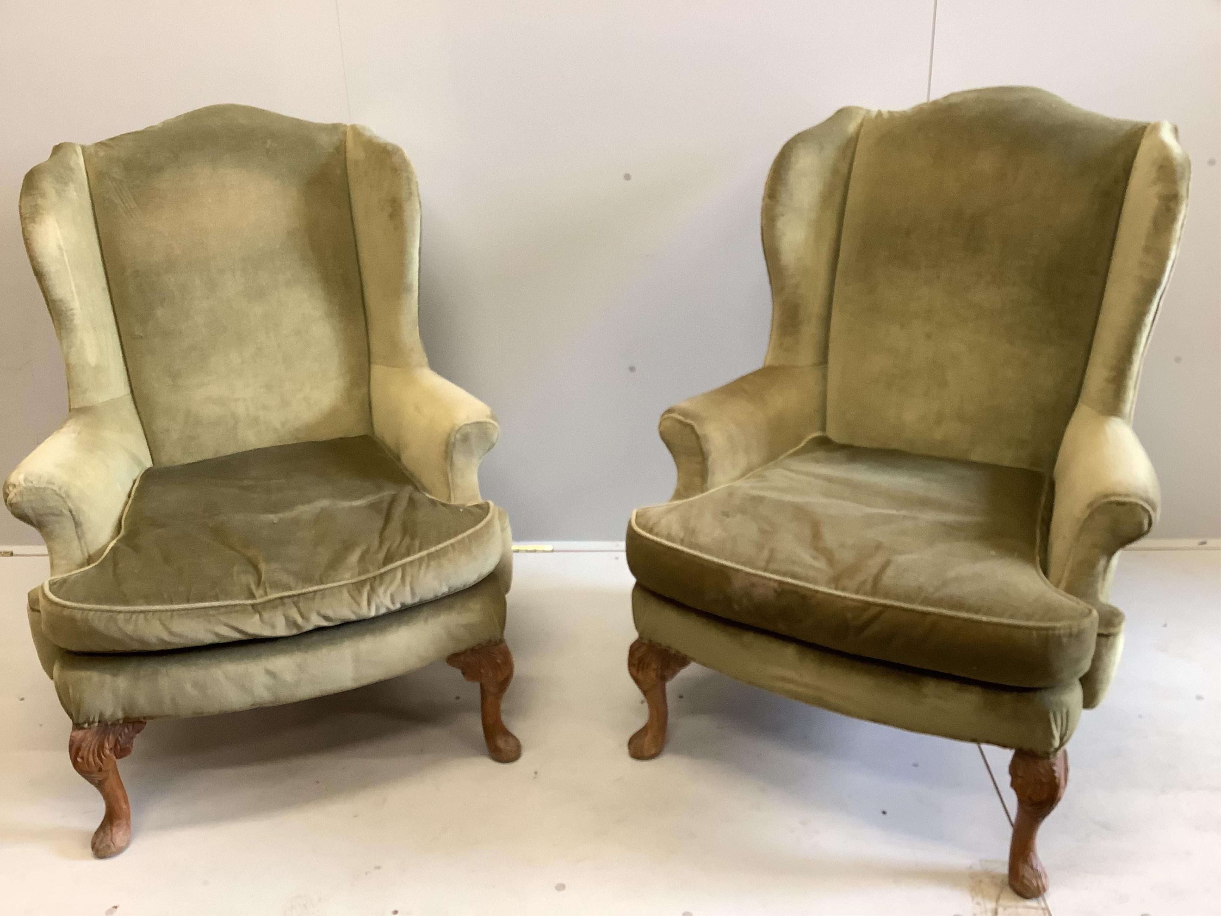 A pair of George I style upholstered wing armchairs, width 82cm, depth 88cm, height 104cm. Condition - fair